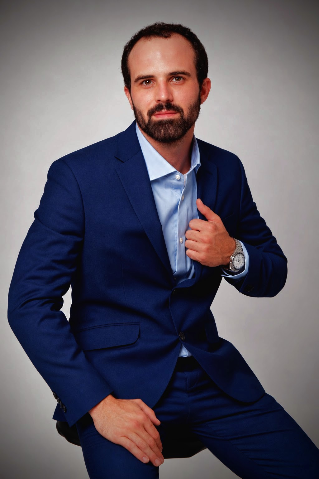 Kyle Foster, founder and senior developer at Sanderson Technology Enterprises, wearing a navy suit